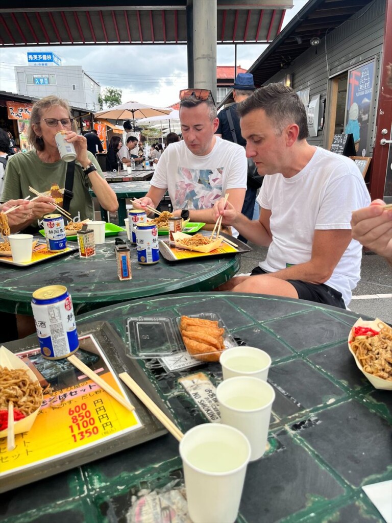Close-up of sizzling Fujinomiya-style yakisoba (noodle）with vegetables and meat.
