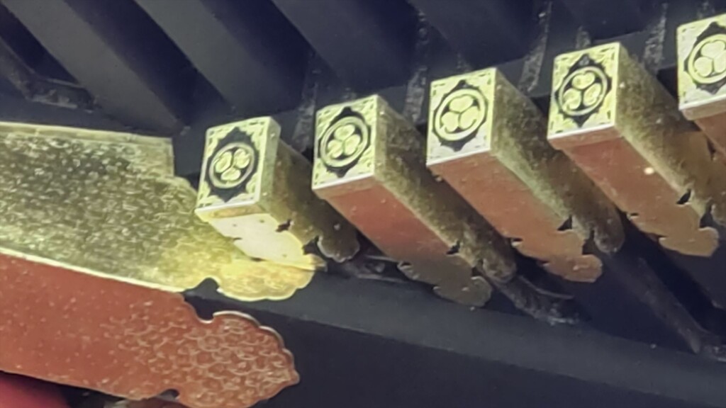 Close-up of upside-down Tokugawa hollyhock crest (aoi mon) at Kunozan Toshogu Shrine, symbolizing never-ending prosperity.