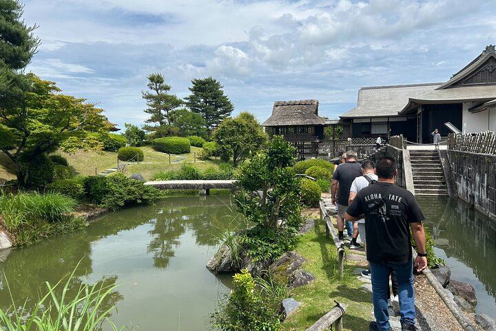 Visitors stroll through the peaceful garden of the Tea Museum of Shizuoka, where tea culture blends beautifully with Japanese landscape design.