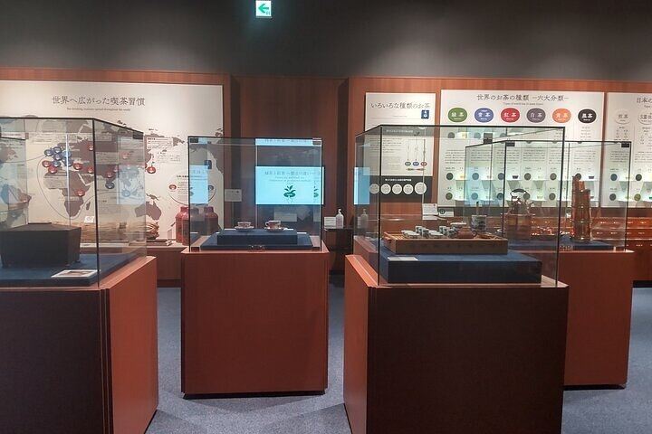 Indoor exhibition cases displaying global tea culture artifacts and history at the Shimada tea museum.