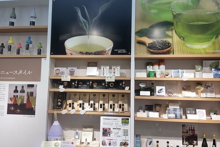 Wall display of various tea products including teaware, packaged teas, and tea-themed gifts, highlighting global tea culture.