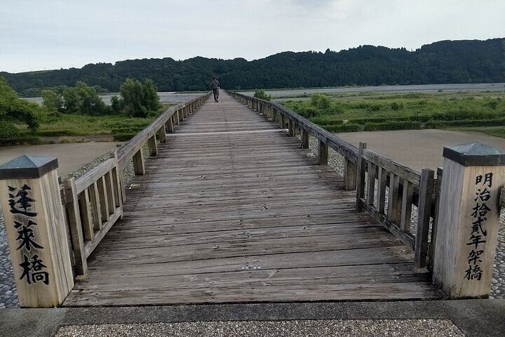Horai Bridge in Shimada, the world’s longest wooden footbridge, certified by Guinness World Records, with a scenic riverside view.