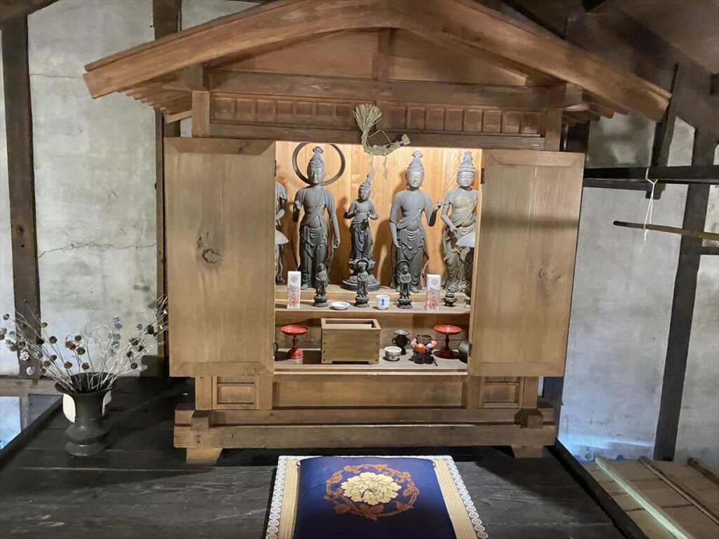 Several Kannon statues displayed inside Takasago Brewery, believed to protect the sake-making process.